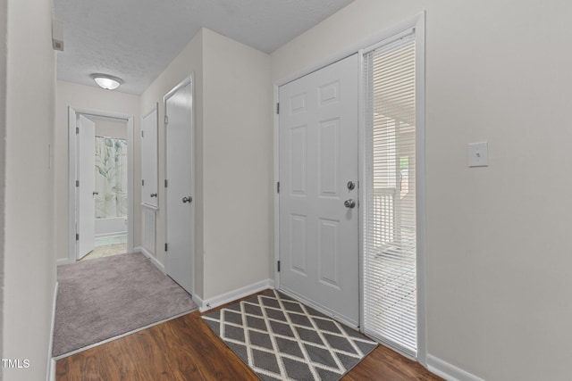 667 Bartons Lndg Unit 8, Fayetteville, NC 28314 - foyer entrance featuring dark wood-style floors and a textured ceiling