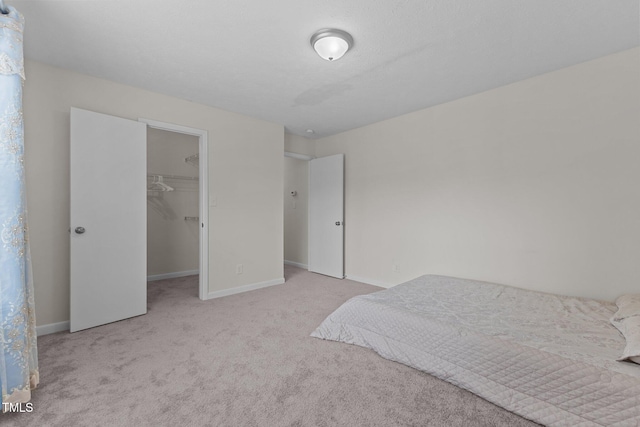 667 Bartons Lndg Unit 8, Fayetteville, NC 28314 - carpeted bedroom with a walk in closet and a closet