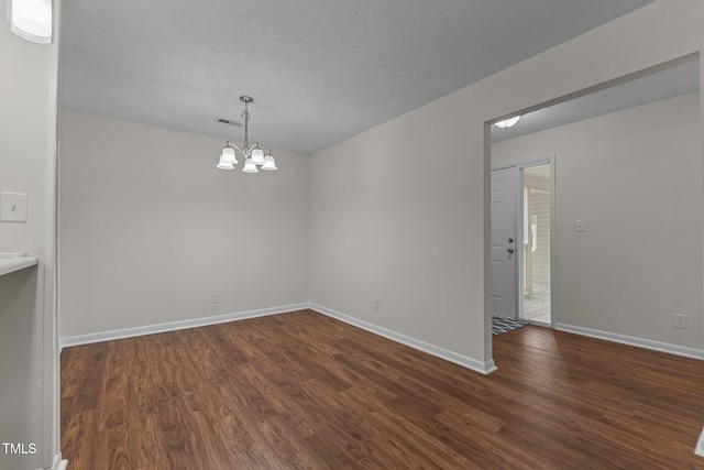 667 Bartons Lndg Unit 8, Fayetteville, NC 28314 - unfurnished dining area with dark wood-style flooring and a chandelier