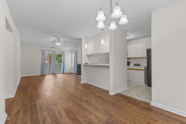 667 Bartons Lndg Unit 8, Fayetteville, NC 28314 - unfurnished living room with a ceiling fan, wood finished floors, and a chandelier