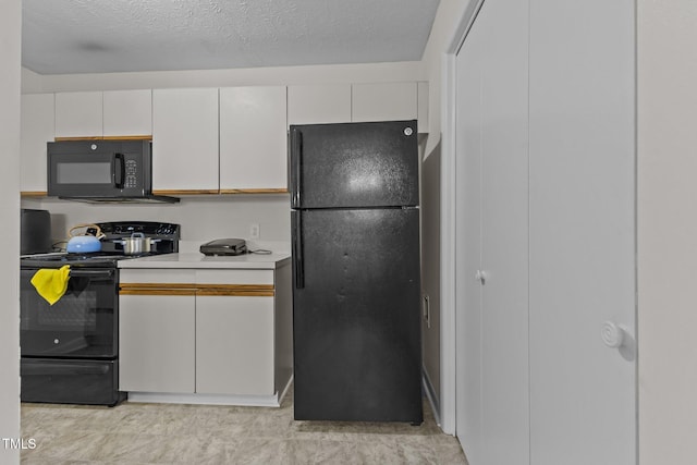 667 Bartons Lndg Unit 8, Fayetteville, NC 28314 - kitchen featuring black appliances, white cabinetry, and light countertops