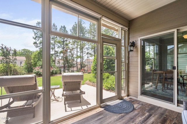 1523 Anthology Dr, Durham, NC 27703 - doorway to outside with wooden walls and dark wood-style floors