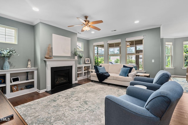 1523 Anthology Dr, Durham, NC 27703 - living room with a ceiling fan, crown molding, wood finished floors, a fireplace, and recessed lighting