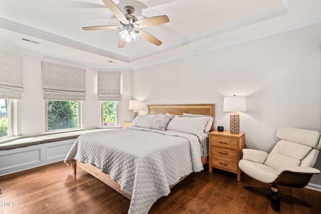 1523 Anthology Dr, Durham, NC 27703 - bedroom featuring a raised ceiling, multiple windows, crown molding, hardwood / wood-style floors, and a ceiling fan
