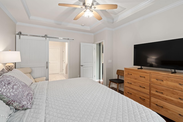 1523 Anthology Dr, Durham, NC 27703 - bedroom with a barn door, ornamental molding, ceiling fan, and a raised ceiling
