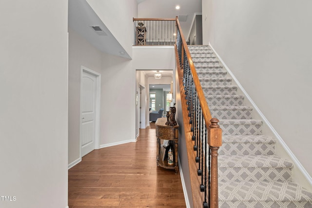 1523 Anthology Dr, Durham, NC 27703 - stairs with wood finished floors and a towering ceiling