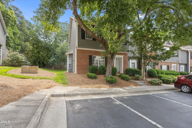 4406 Still Pines Dr, Raleigh, NC 27613 - view of front of home with brick siding and uncovered parking