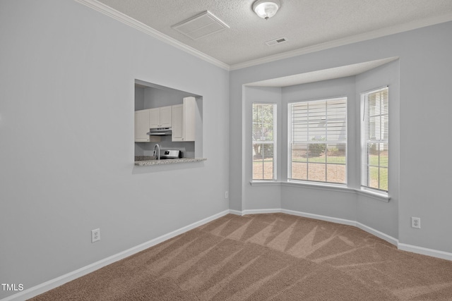 4406 Still Pines Dr, Raleigh, NC 27613 - carpeted empty room featuring a textured ceiling and crown molding