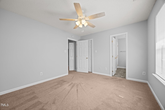 4406 Still Pines Dr, Raleigh, NC 27613 - unfurnished bedroom with carpet, ensuite bath, and a ceiling fan