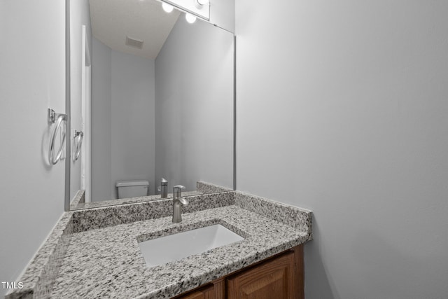 4406 Still Pines Dr, Raleigh, NC 27613 - bathroom featuring vanity and toilet