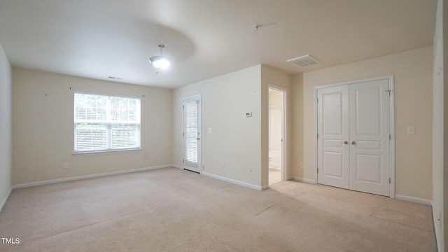 5916 Longeria Ct, Raleigh, NC 27612 - unfurnished bedroom featuring light colored carpet and a closet