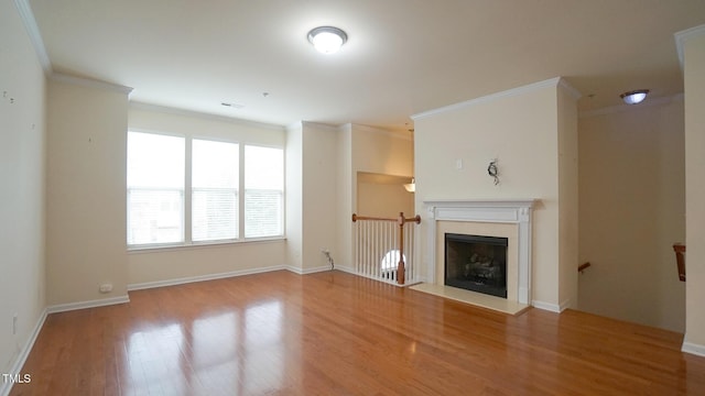 5916 Longeria Ct, Raleigh, NC 27612 - unfurnished living room with wood finished floors, ornamental molding, and a fireplace