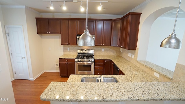 5916 Longeria Ct, Raleigh, NC 27612 - kitchen with stainless steel gas range, light stone counters, wood finished floors, a peninsula, and crown molding