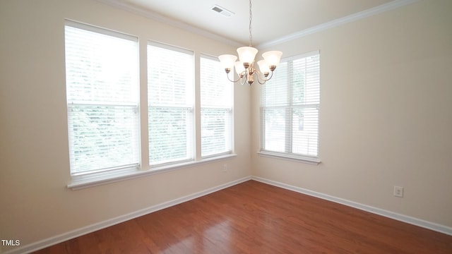 5916 Longeria Ct, Raleigh, NC 27612 - unfurnished dining area featuring a chandelier, crown molding, and wood finished floors