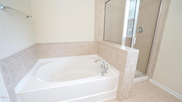 5916 Longeria Ct, Raleigh, NC 27612 - bathroom featuring a garden tub, a stall shower, and tile patterned floors