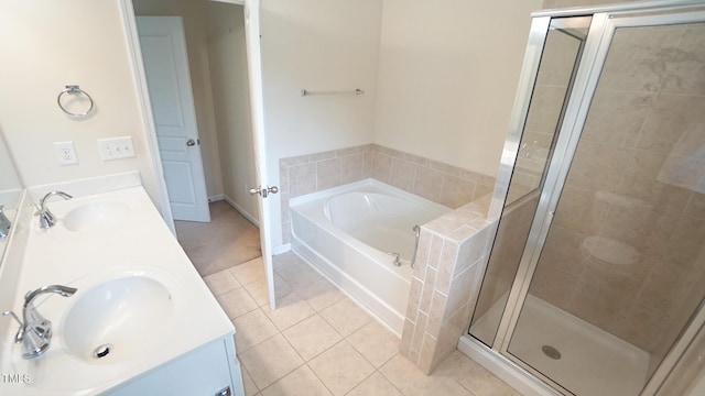 5916 Longeria Ct, Raleigh, NC 27612 - bathroom with tile patterned flooring, a garden tub, a stall shower, and double vanity