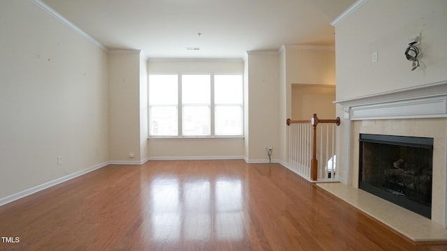 5916 Longeria Ct, Raleigh, NC 27612 - unfurnished living room featuring wood finished floors, a fireplace, and ornamental molding