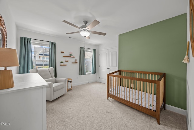 1600 Sandy Prairie Dr, Wendell, NC 27591 - bedroom with carpet, a closet, a ceiling fan, and a crib