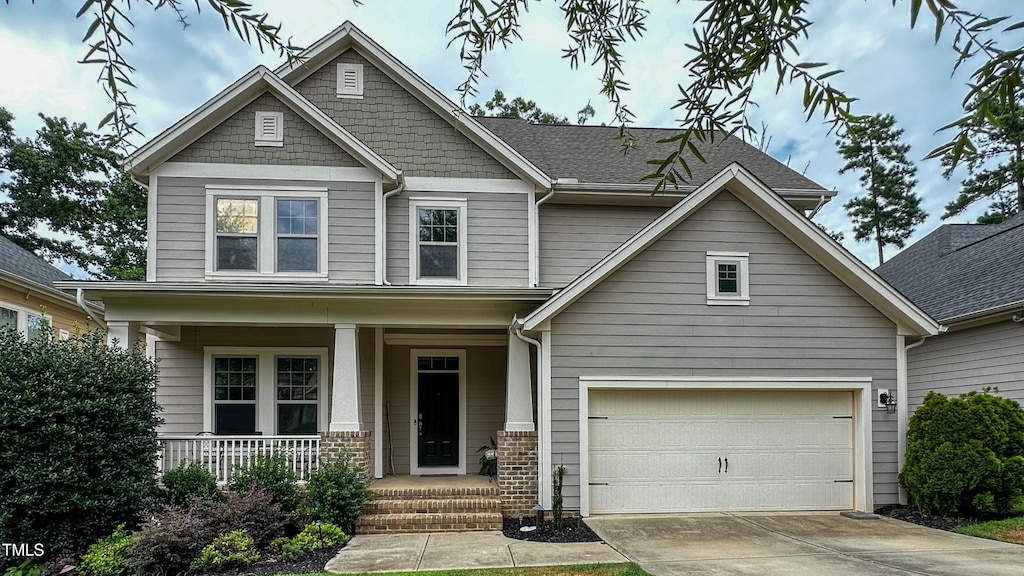 621 Ancient Oaks Dr, Holly Springs, NC 27540 - craftsman inspired home featuring covered porch and driveway