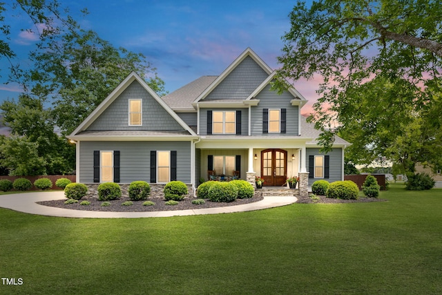 532 Joe Collins Rd, Lillington, NC 27546 - craftsman-style house with french doors, a lawn, covered porch, stone siding, and roof with shingles