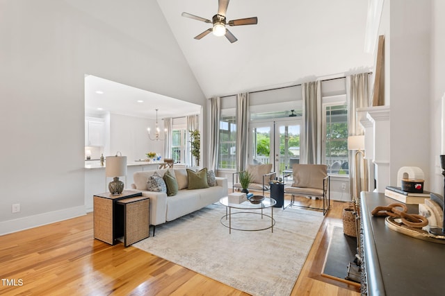 532 Joe Collins Rd, Lillington, NC 27546 - living room with high vaulted ceiling, ceiling fan, wood finished floors, a chandelier, and french doors