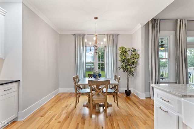 532 Joe Collins Rd, Lillington, NC 27546 - dining area with a chandelier, light wood-style floors, and crown molding