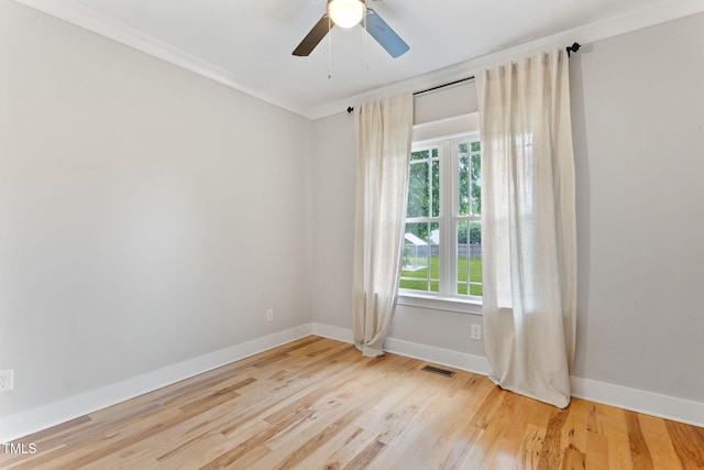 532 Joe Collins Rd, Lillington, NC 27546 - spare room with ornamental molding, wood finished floors, and ceiling fan