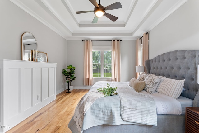 532 Joe Collins Rd, Lillington, NC 27546 - bedroom with light wood-style flooring, a tray ceiling, ceiling fan, and crown molding