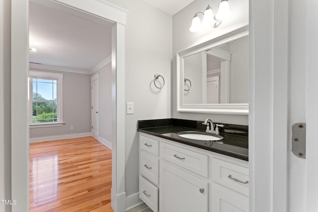 532 Joe Collins Rd, Lillington, NC 27546 - bathroom featuring vanity, wood finished floors, and crown molding
