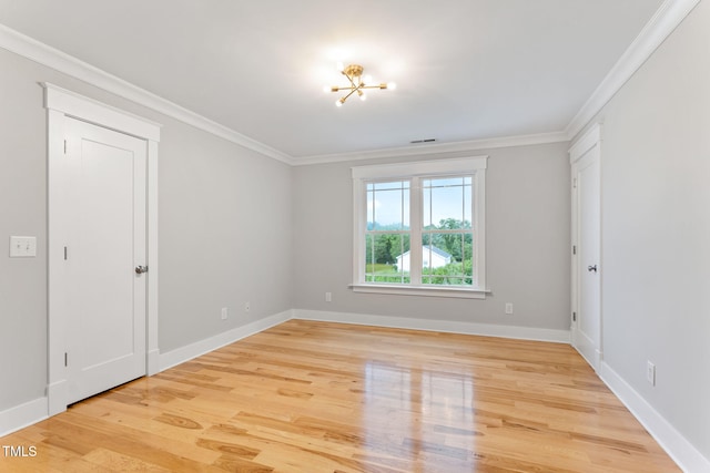 532 Joe Collins Rd, Lillington, NC 27546 - empty room with wood finished floors, crown molding, and a chandelier