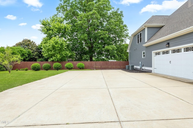 532 Joe Collins Rd, Lillington, NC 27546 - view of side of home featuring driveway, a shingled roof, and a garage