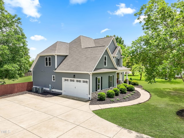 532 Joe Collins Rd, Lillington, NC 27546 - view of home's exterior with a shingled roof, an attached garage, stone siding, and driveway