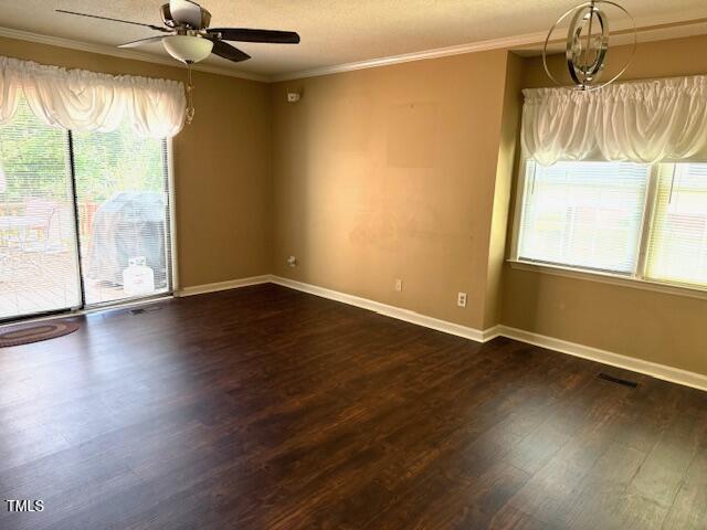 120 W Front St, Oxford, NC 27565 - empty room featuring ceiling fan, crown molding, and dark wood-type flooring