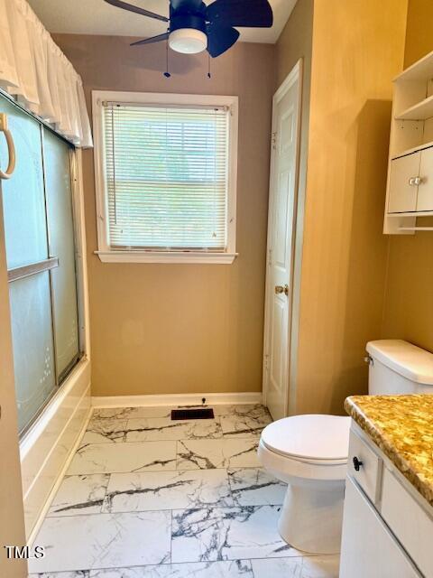 120 W Front St, Oxford, NC 27565 - full bathroom with a ceiling fan, vanity, marble look tile flooring, and enclosed tub / shower combo