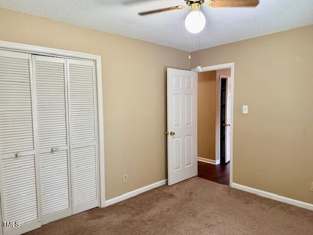 120 W Front St, Oxford, NC 27565 - unfurnished bedroom featuring carpet flooring, a closet, and a ceiling fan