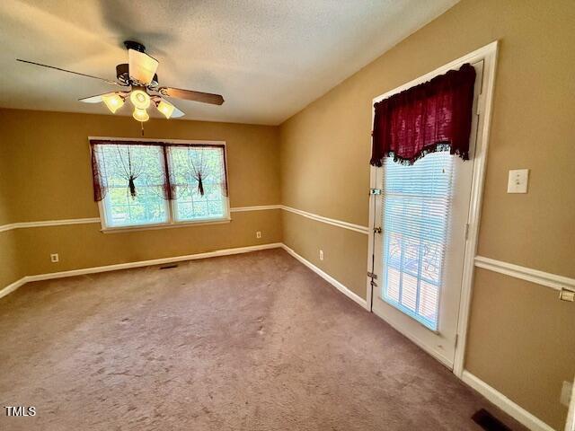 120 W Front St, Oxford, NC 27565 - carpeted empty room featuring a ceiling fan and baseboards