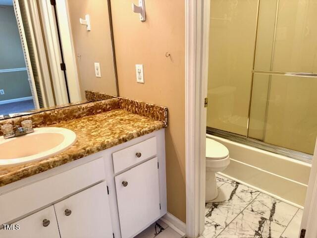 120 W Front St, Oxford, NC 27565 - bathroom featuring vanity, marble look tile flooring, and shower / bath combination with glass door