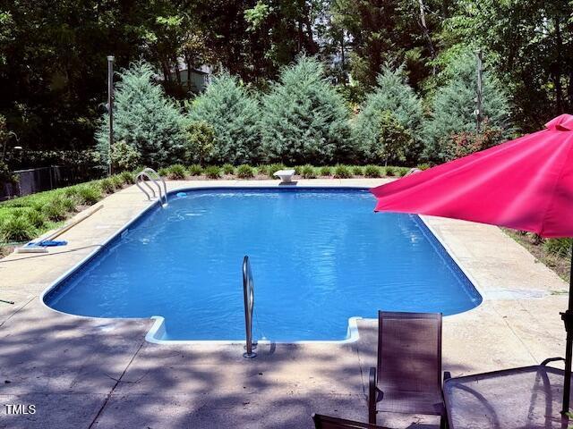 120 W Front St, Oxford, NC 27565 - outdoor pool featuring a patio, a diving board, and a water slide