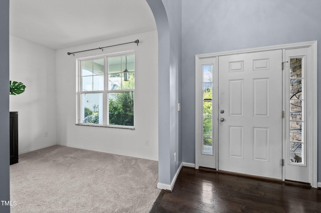 7 Faircroft Ct, Durham, NC 27703 - foyer entrance with arched walkways and dark wood-type flooring