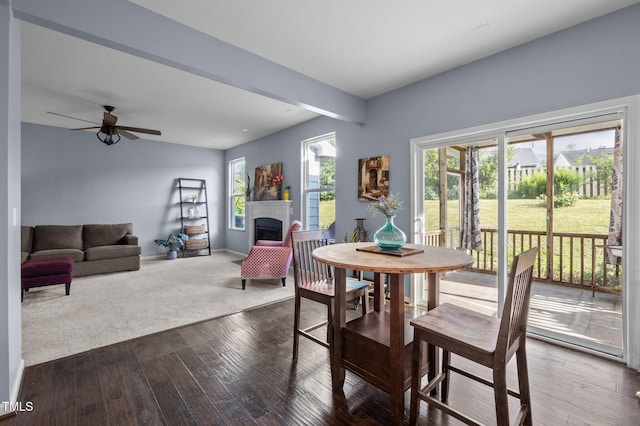 7 Faircroft Ct, Durham, NC 27703 - dining space with a fireplace, dark wood finished floors, and ceiling fan