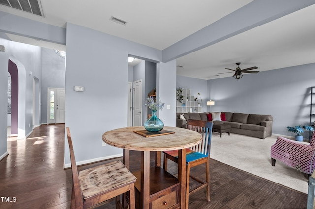 7 Faircroft Ct, Durham, NC 27703 - dining area with dark wood finished floors, arched walkways, and ceiling fan