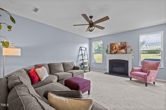 7 Faircroft Ct, Durham, NC 27703 - living room with ceiling fan, carpet floors, and a fireplace with flush hearth