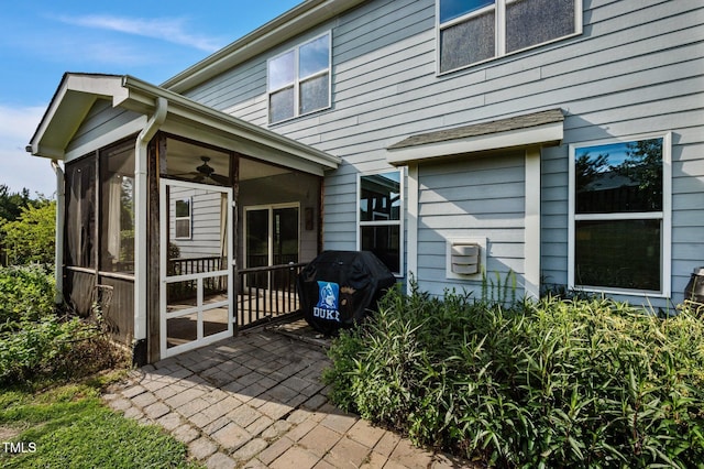 7 Faircroft Ct, Durham, NC 27703 - rear view of property with a sunroom and a patio area