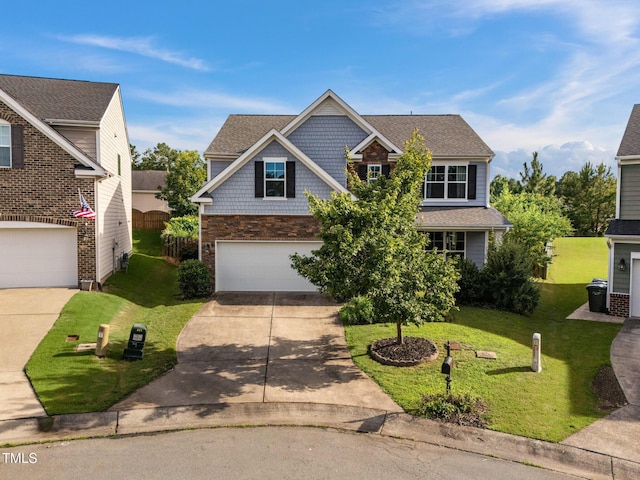7 Faircroft Ct, Durham, NC 27703 - view of front of property featuring driveway, a front lawn, an attached garage, and stone siding