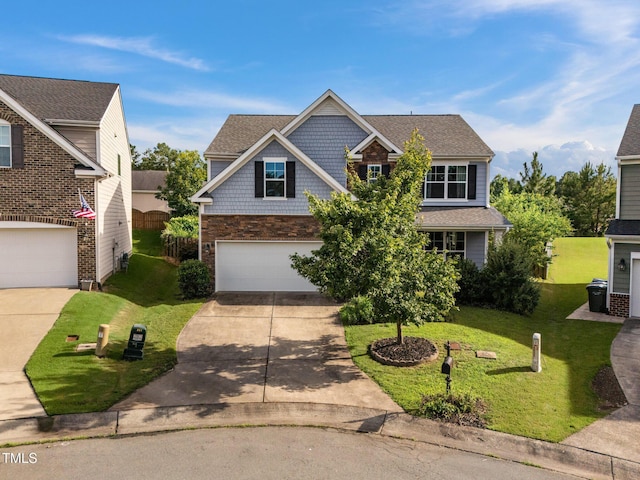 7 Faircroft Ct, Durham, NC 27703 - view of front facade with concrete driveway, a front lawn, an attached garage, and stone siding