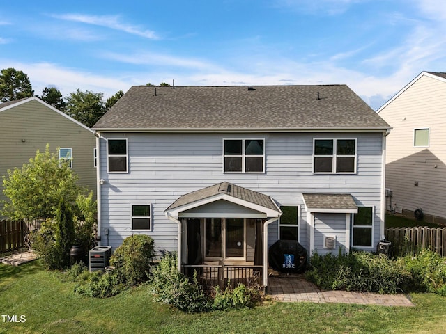 7 Faircroft Ct, Durham, NC 27703 - rear view of property with a sunroom, a patio, and roof with shingles