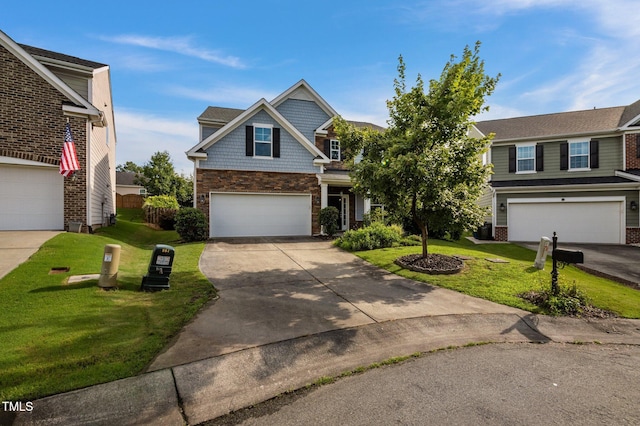 7 Faircroft Ct, Durham, NC 27703 - view of front of house with a front lawn, an attached garage, concrete driveway, and stone siding