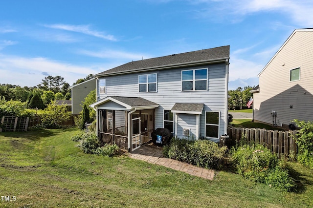 7 Faircroft Ct, Durham, NC 27703 - back of house with a sunroom and a shingled roof