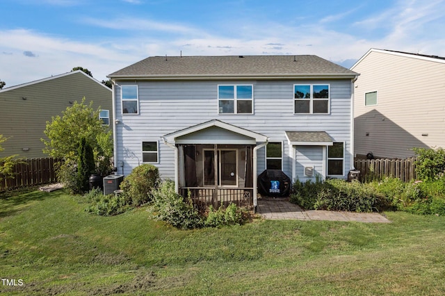 7 Faircroft Ct, Durham, NC 27703 - rear view of property with a sunroom, a patio area, a fenced backyard, and a shingled roof