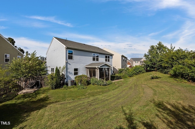 7 Faircroft Ct, Durham, NC 27703 - rear view of house featuring a sunroom and a yard